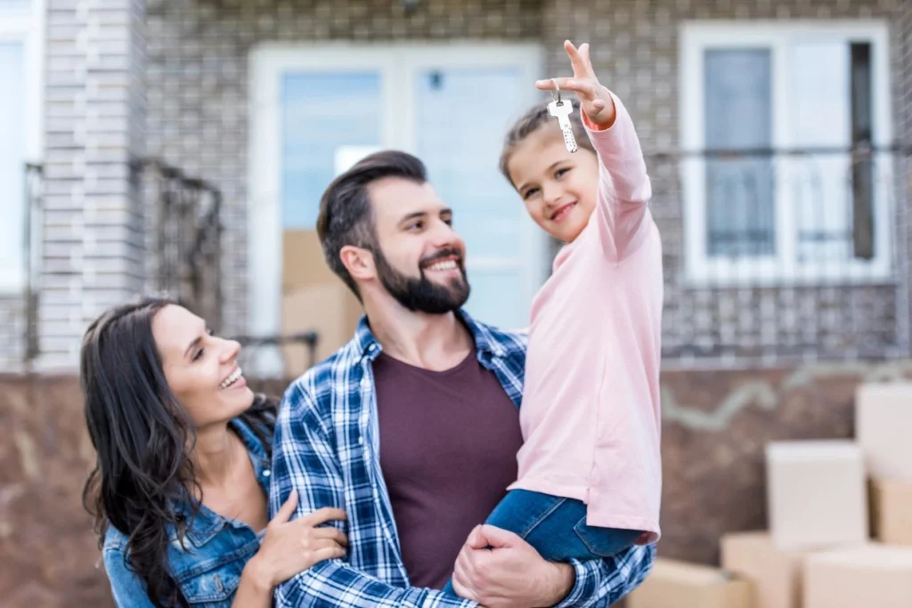 a happy family got their key from their new house