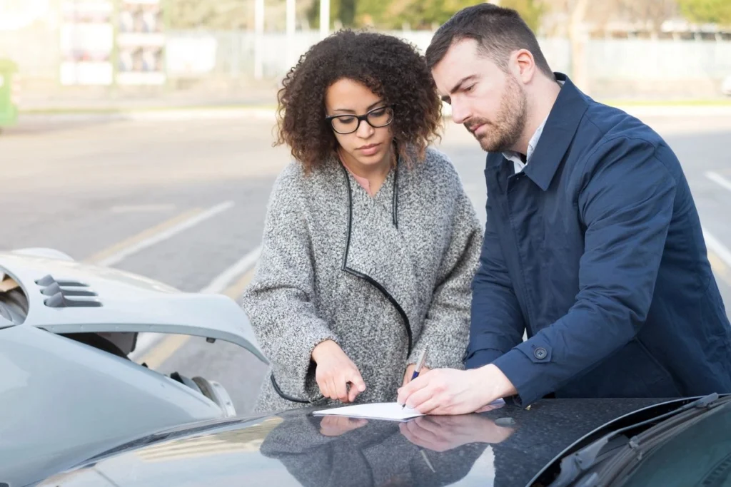 a persong checking the insurance of the car